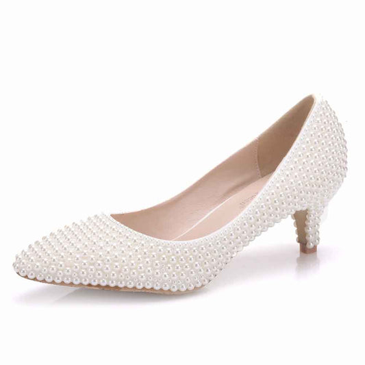 Elegant white pearl wedding pumps for brides featuring a stylish low heel and pearl embellishments