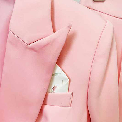 Close-up of a pink blazer pantsuit for women featuring a stylish pocket square and elegant lapels