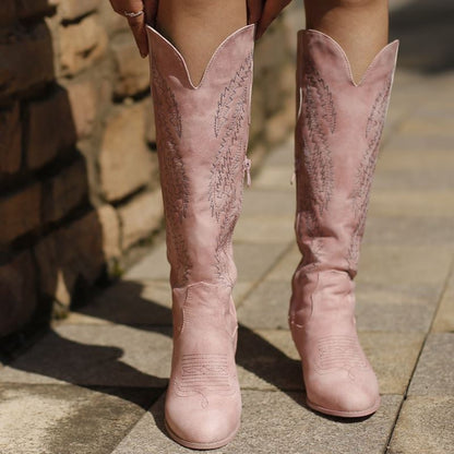 Stylish pink cowboy boots for bridesmaids with elegant stitching and high shafts