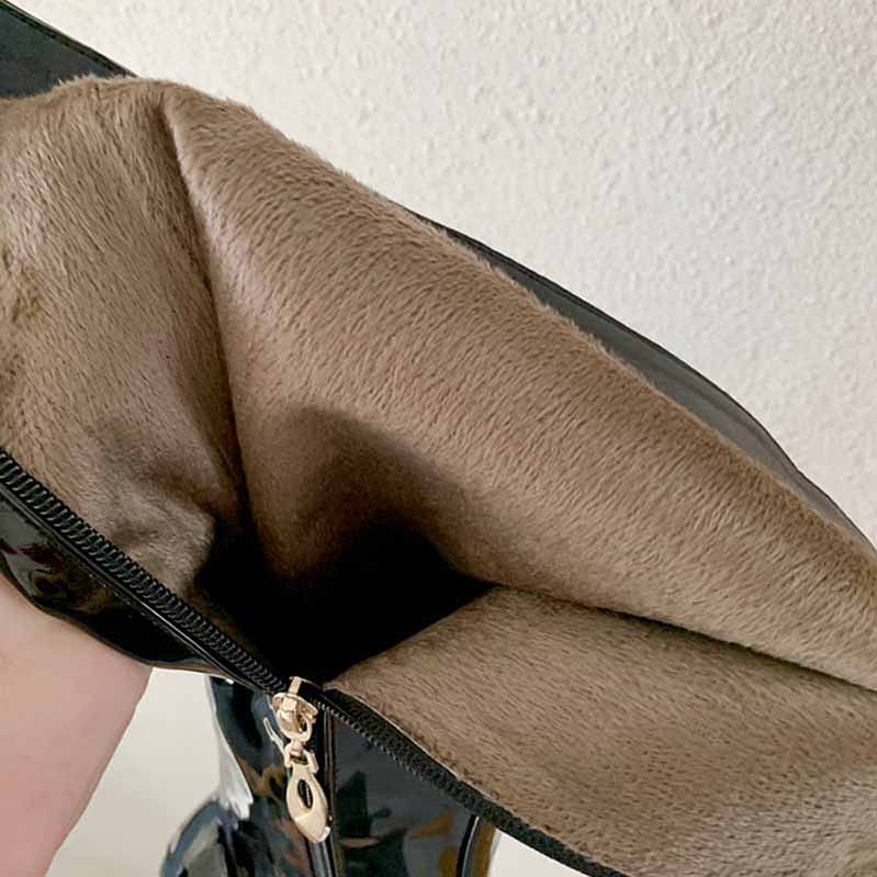 Inside view of platform high heel boots for women showing soft lining and zipper detail