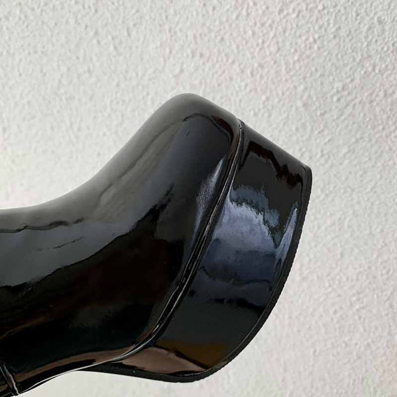 Shiny black platform high heel boots for women featuring a sleek design and stylish silhouette