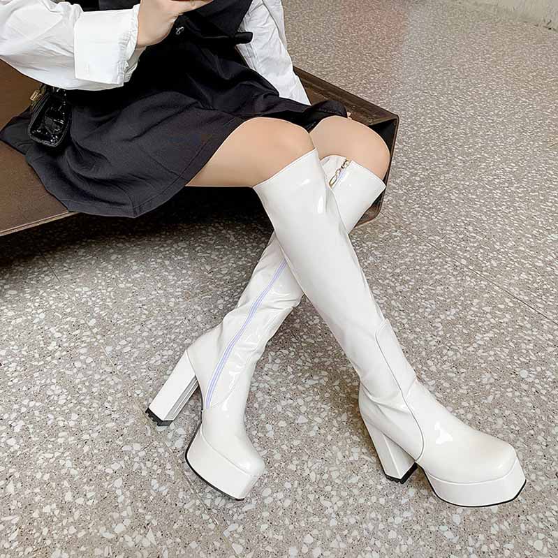 Stylish white platform high heel boots for women with a sleek design and chunky heels