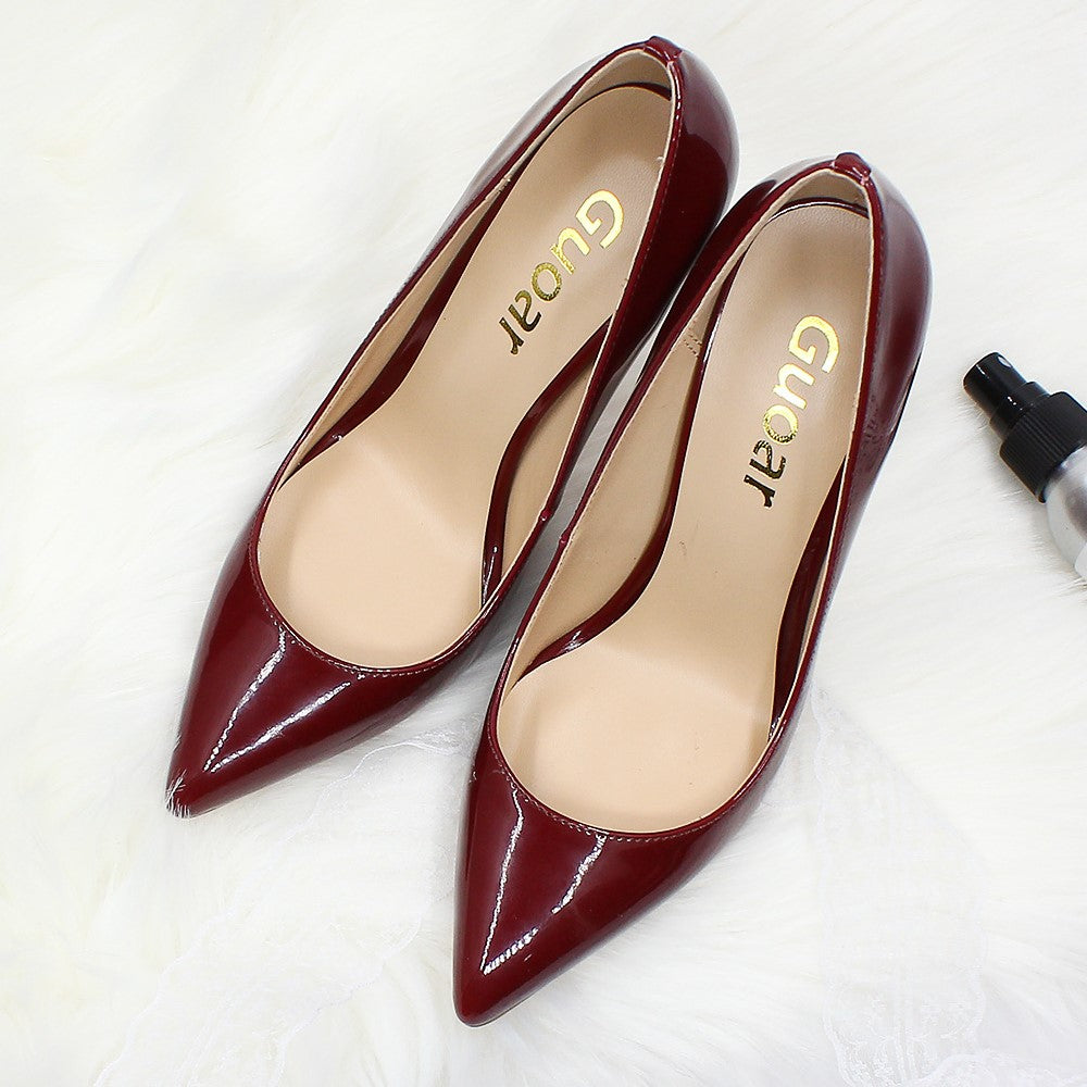 Burgundy pointed toe prom shoes by Tucomosi with sleek, glossy finish for elegant style