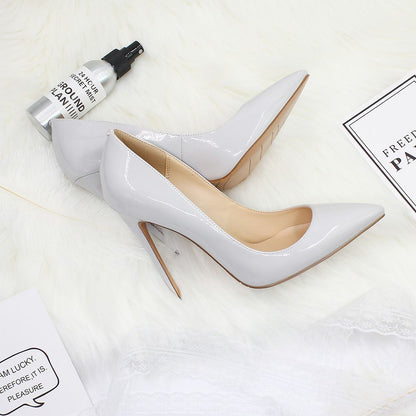 White pointed toe prom shoes in sleek gray with a glossy finish and high heels