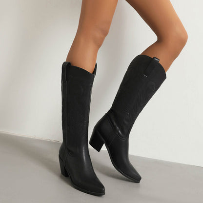 Stylish pointed toe western knee high boots in black with decorative stitching and block heel