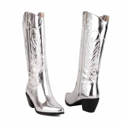 Shiny silver pointed toe western knee high boots with decorative stitching and block heels
