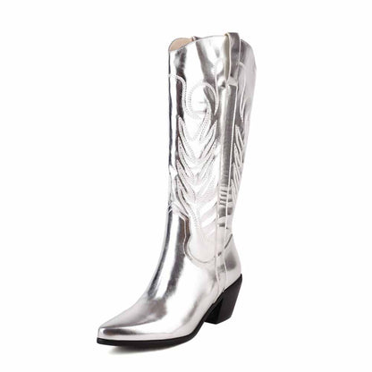 Shiny silver pointed toe western knee high boots with detailed stitching for a stylish cowgirl look
