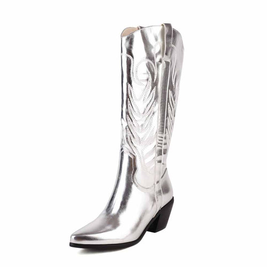 Shiny silver pointed toe western knee high boots with detailed stitching for a stylish cowgirl look