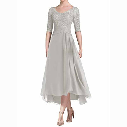 Elegant ruffle wedding guest dress for women in light gray with intricate bead detailing and a flowy design