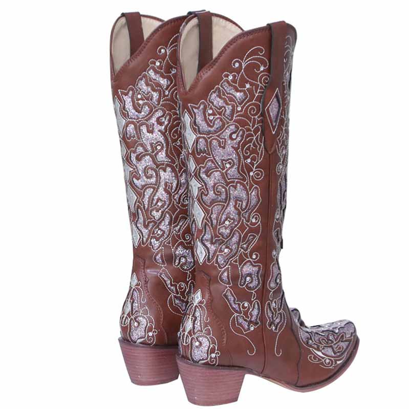 Rustic bridal cowgirl boots in brown leather with intricate embroidered detailing on the shaft