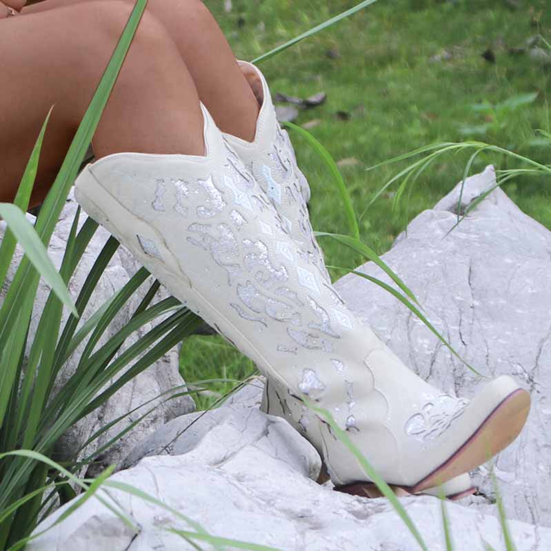 Stylish rustic bridal cowgirl boots featuring intricate embroidery for a unique wedding look