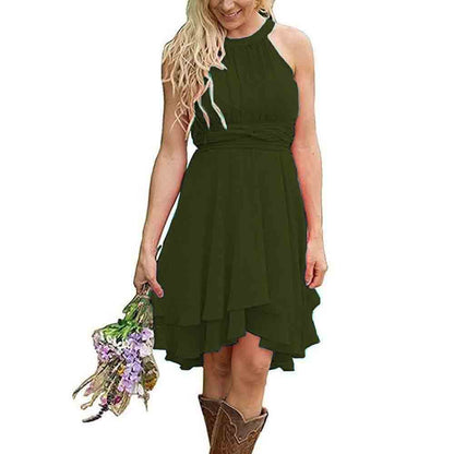 Green cowgirl bridesmaid dress for rustic wedding featuring a flowy design and halter neck style.