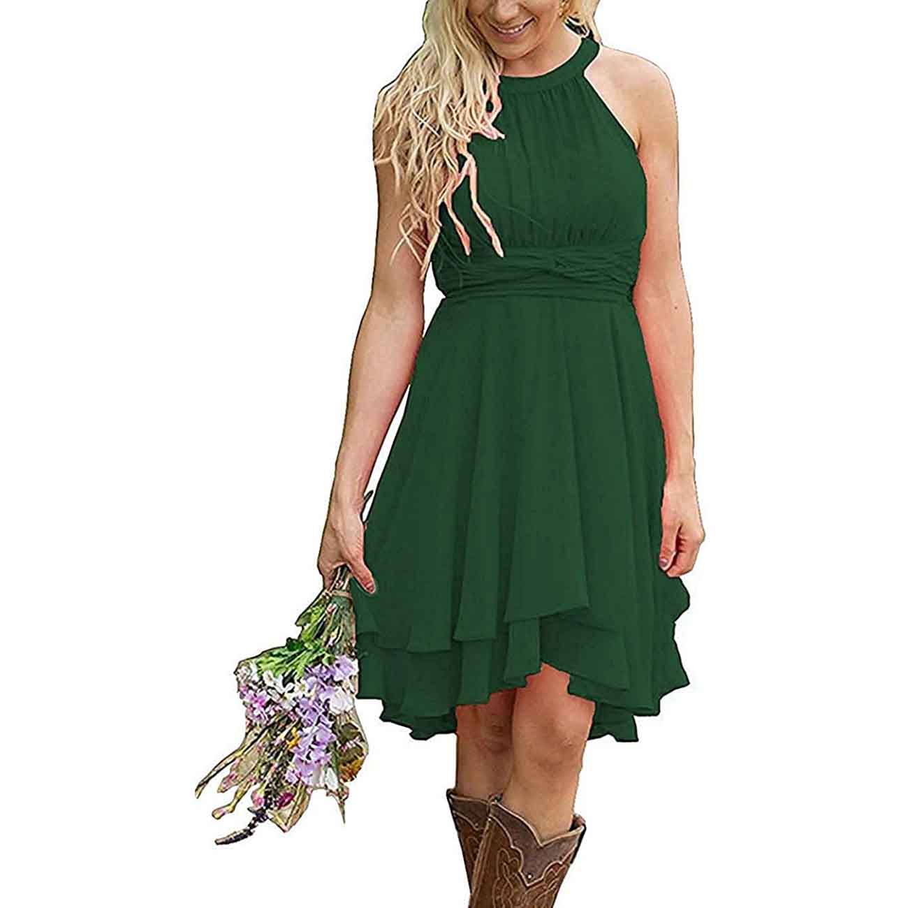 Green cowgirl bridesmaid dress for rustic wedding with a flowy design and floral bouquet