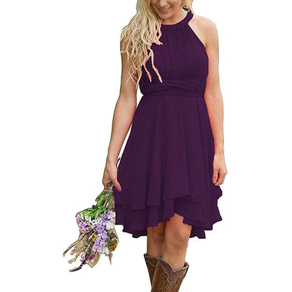 Purple cowgirl bridesmaid dress for rustic wedding featuring a halter neck and flowy skirt