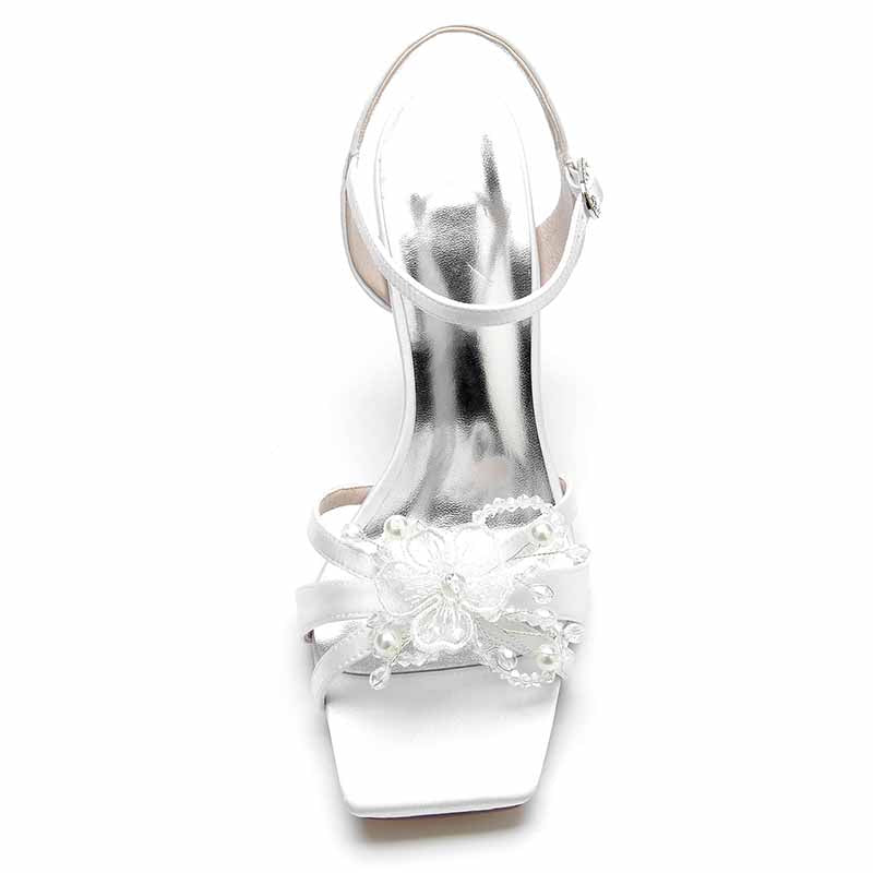 Elegant white satin pump heel sandal for bridesmaids featuring flower embellishments and a stylish ankle strap
