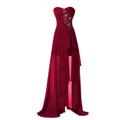Elegant strapless bridesmaid dress long in burgundy with a flowing high-low hem and embellishments