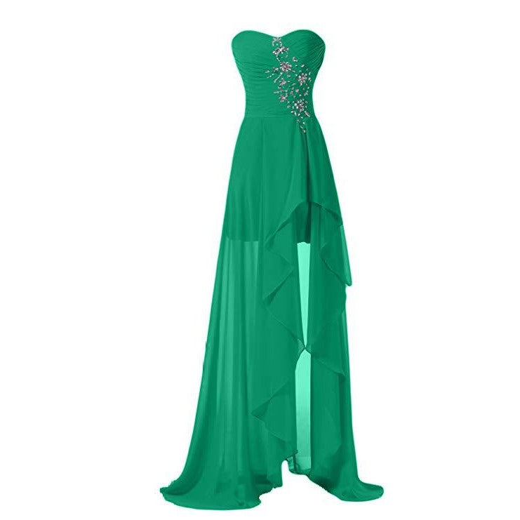 Green strapless bridesmaid dress long with a flowing design and decorative jewels on the bodice