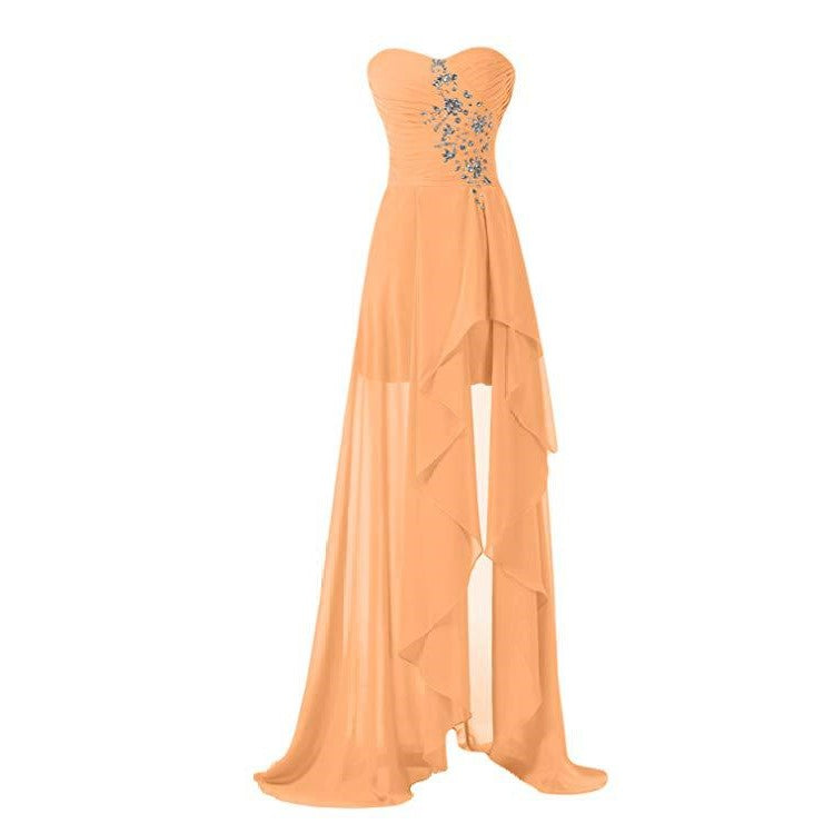 Elegant strapless bridesmaid dress long in peach with floral embellishments and layered skirt