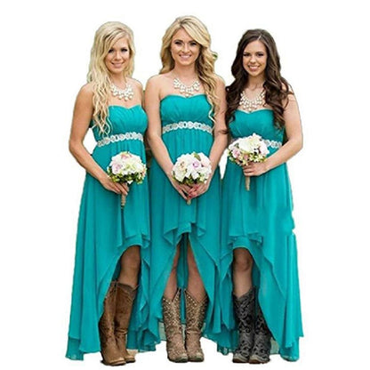 Three bridesmaids in strapless country wedding dress with high-low hemlines and cowboy boots