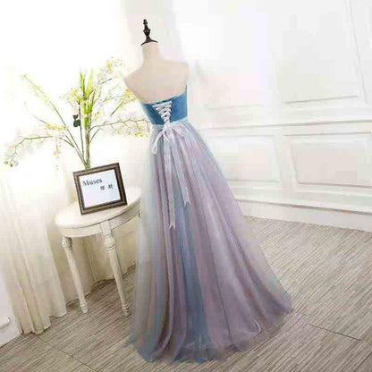 Elegant strapless prom dress in blue and purple with a lace-up back design