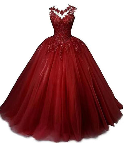 Elegant red sweet 16 ball gown for women with intricate lace details and a full tulle skirt