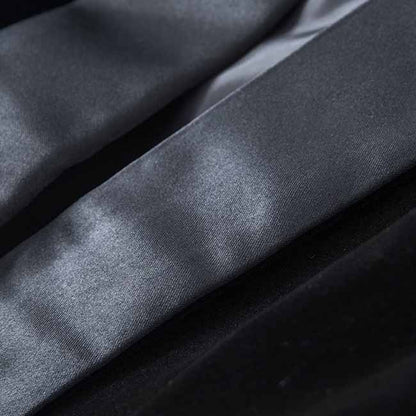 Close-up of a luxurious velvet wedding blazer neckline with smooth satin detailing