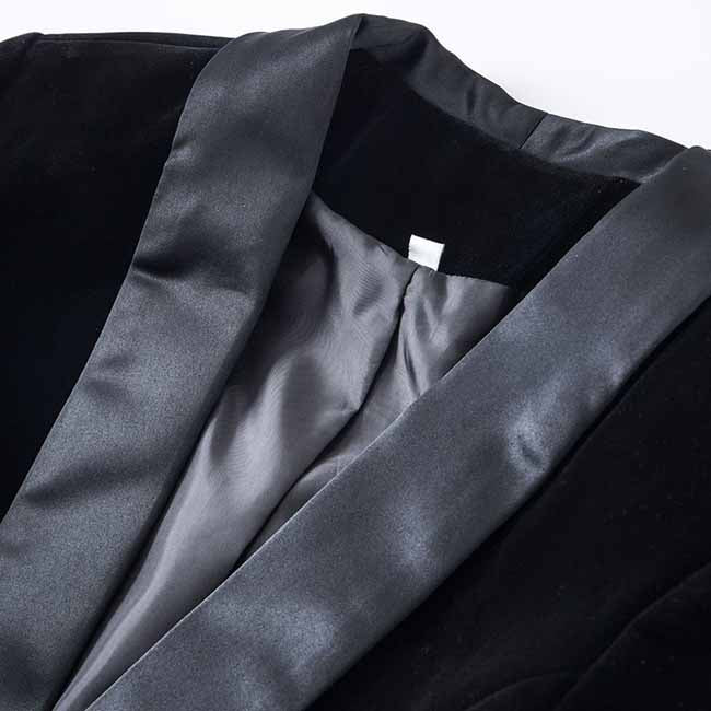 Close-up of a velvet wedding blazer with a satin shawl collar for elegant bridal wear