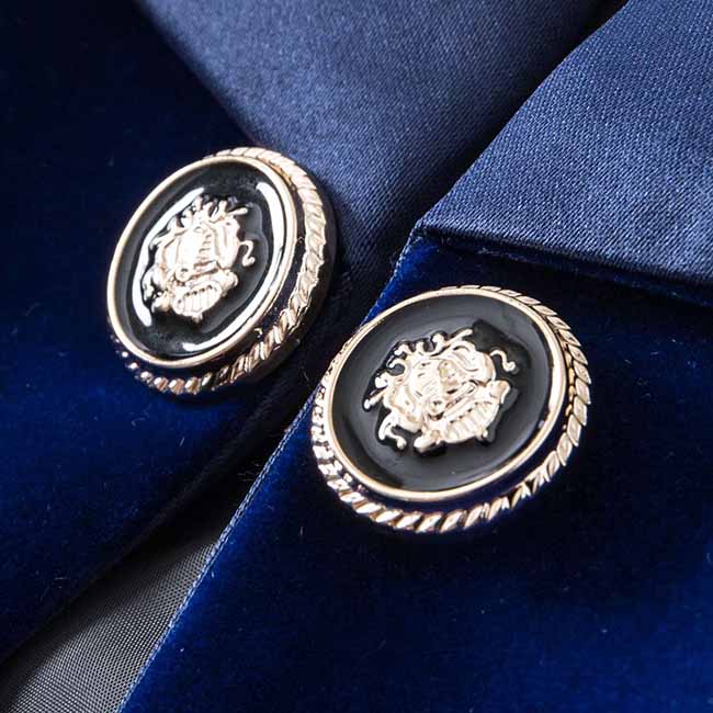Close-up of the buttons on a luxurious velvet wedding blazer in deep navy blue