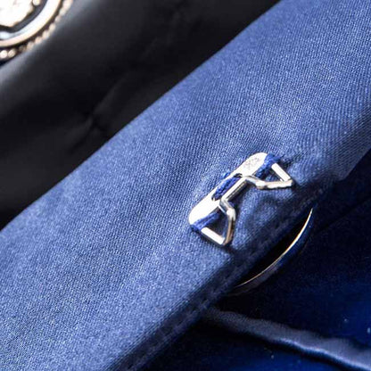 Close-up of a velvet wedding blazer featuring stylish buttons and craftsmanship detail for elegant occasions