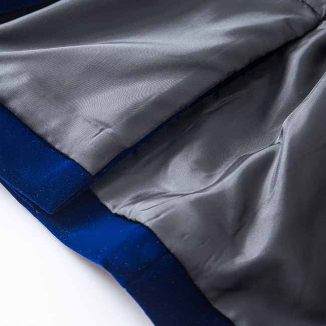 Close-up of the interior lining of a velvet wedding blazer in rich blue color