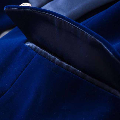 Close-up of a luxurious navy velvet wedding blazer featuring a detailed lapel and pocket design