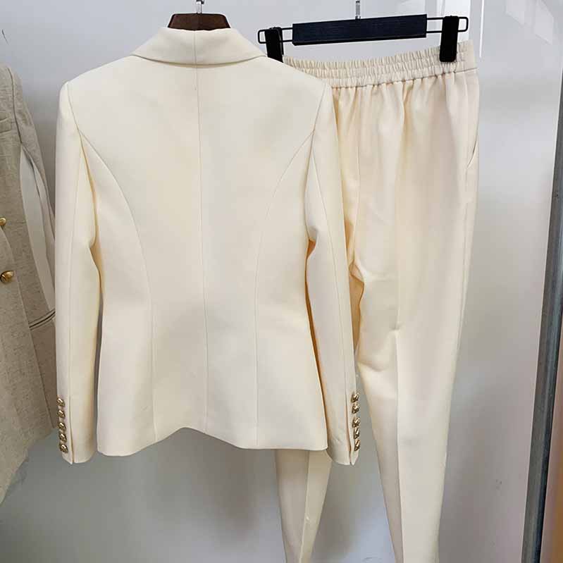 Elegant women two piece set with cream blazer and matching pants, perfect as a formal pantsuit for wedding guest
