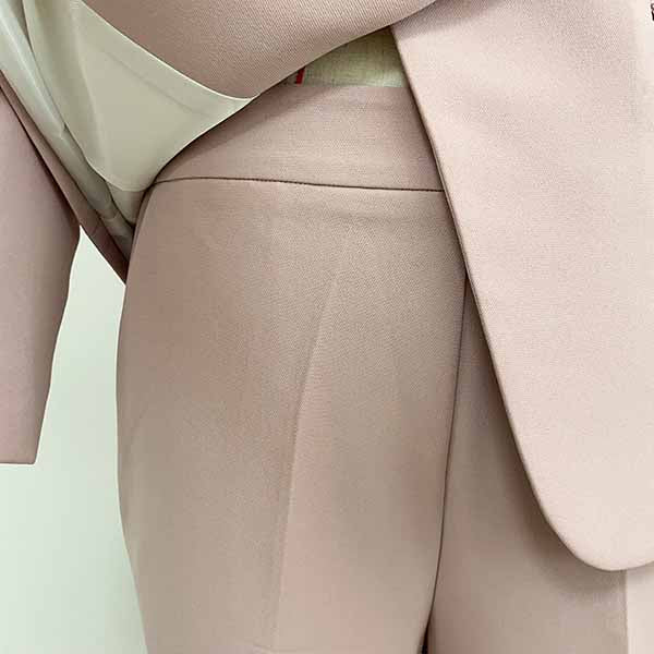 Elegant women two piece set featuring a formal pantsuit for wedding guest in soft pink fabric