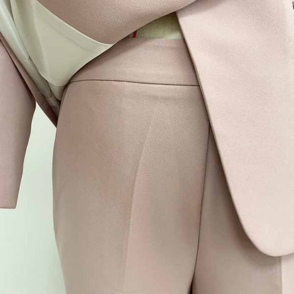Elegant women two piece set featuring a formal pantsuit for wedding guest in soft pink fabric