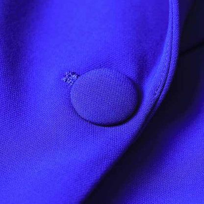 Close-up of a purple fabric featuring a round button for the one button blazer and flare pants set