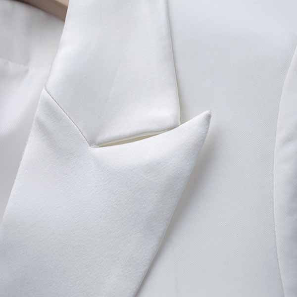 Elegant Tucomosi women's wedding suit with feathers in white featuring a tailored design