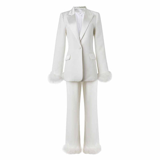 Elegant women's wedding suit with feathers featuring a tailored blazer and matching trousers