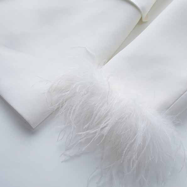 Elegant Tucomosi women's wedding suit with feathers detail for a stylish bridal look