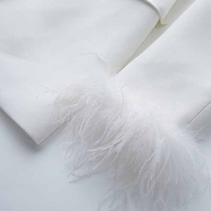 Elegant Tucomosi women's wedding suit with feathers detail for a stylish bridal look