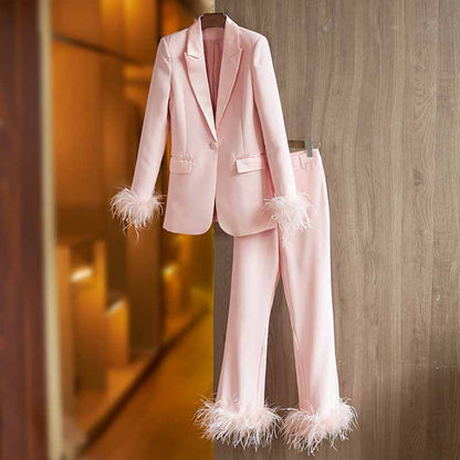 Tucomosi women's wedding suit with feathers in pink featuring feathered cuffs and hems for a stylish look