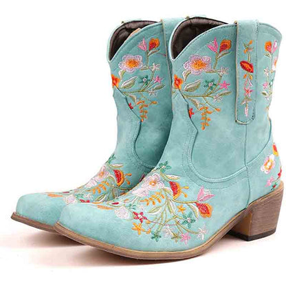 Vintage flower embroidered cowgirl boots in turquoise with colorful floral designs and a stylish heel