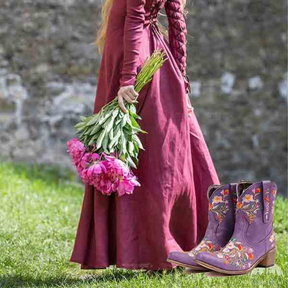 Vintage flower embroidered cowgirl boots in purple with stylish design for a trendy look