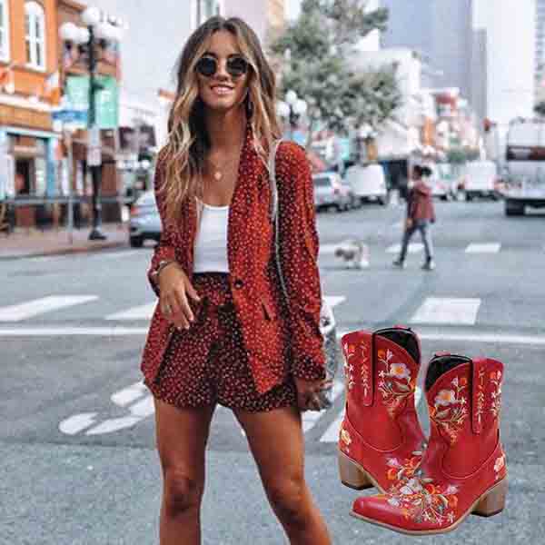 Stylish vintage flower embroidered cowgirl boots paired with a trendy outfit in an urban setting