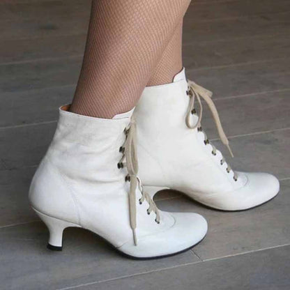 Vintage style wedding boots for women in white with lace-up design and small heels
