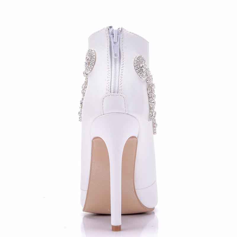 Stylish white ankle boots for women with decorative embellishments and high heels