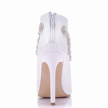 Stylish white ankle boots for women with decorative embellishments and high heels