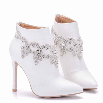 Elegant white ankle boots for women with decorative rhinestone embellishments and stiletto heels