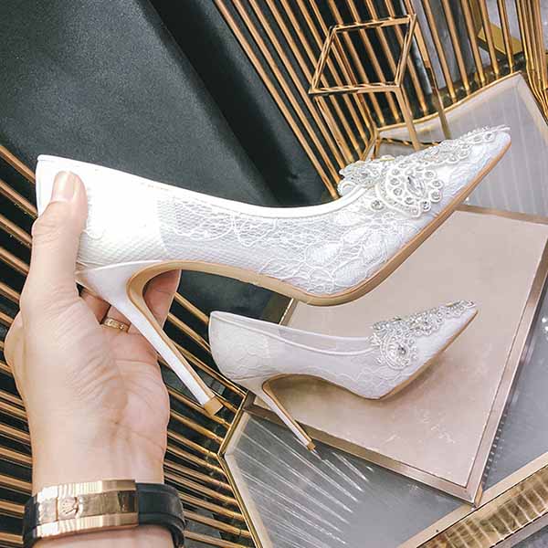 Elegant white rhinestone bridal wedding shoes with lace detailing and high stiletto heels