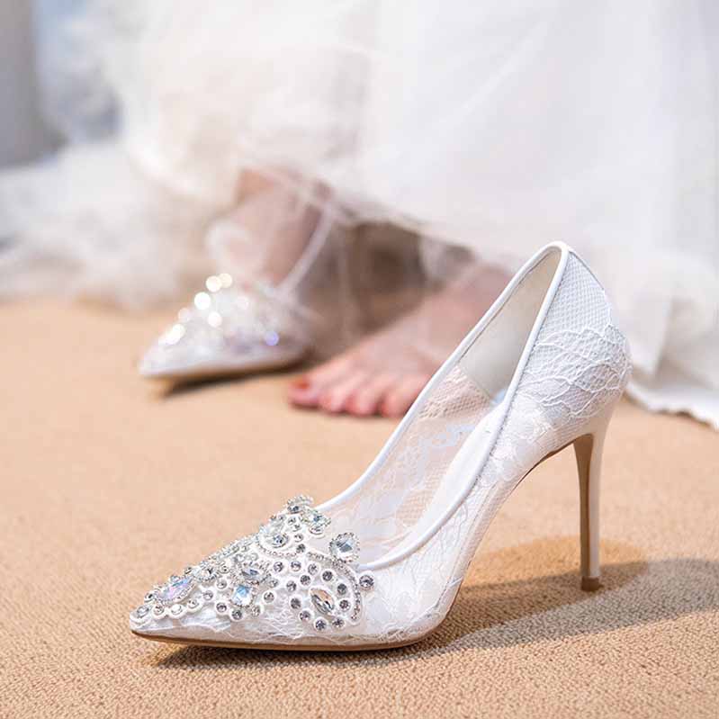 Elegant white rhinestone bridal wedding shoes with lace detailing perfect for brides on their special day
