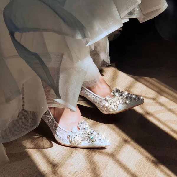 Elegant white rhinestone bridal wedding shoes with intricate detailing, perfect for a romantic wedding